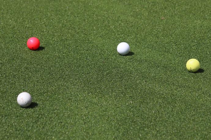 white golf ball on green grass field